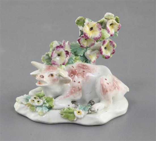 A Derby figure of a lowing cow, c.1765-70, l. 7.6cm, bocage and horns restored